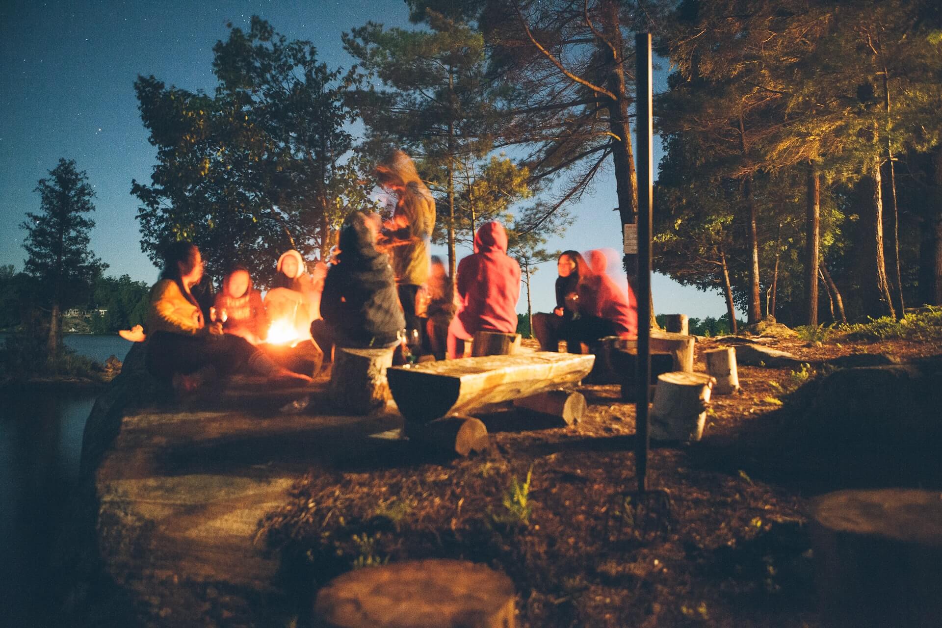 People sitting by a campfire